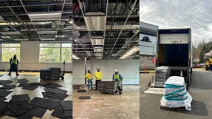 Professional carpet tile installation in progress Installation of black carpet tiles in a commercial space