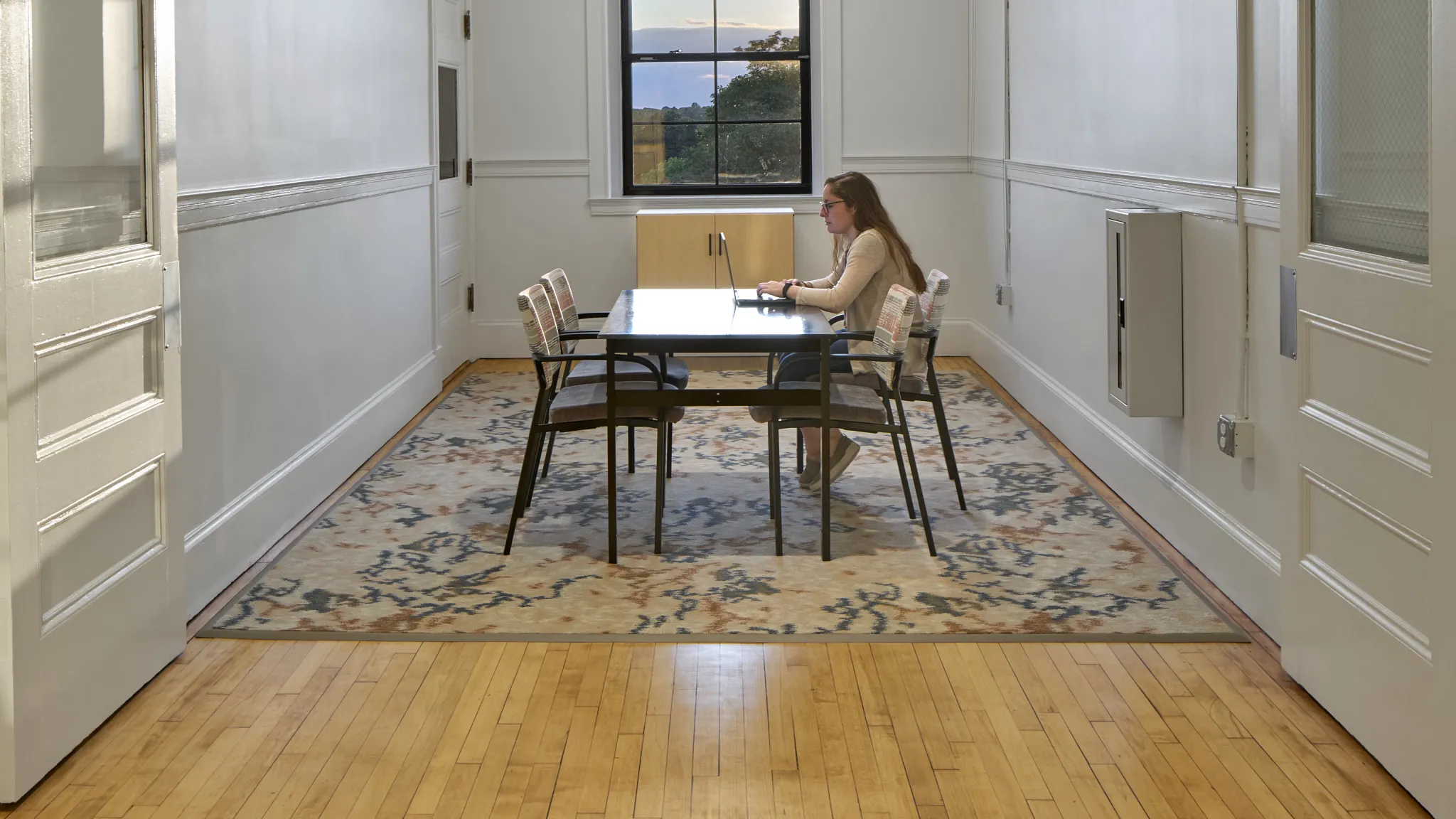 private room with a women working at the table