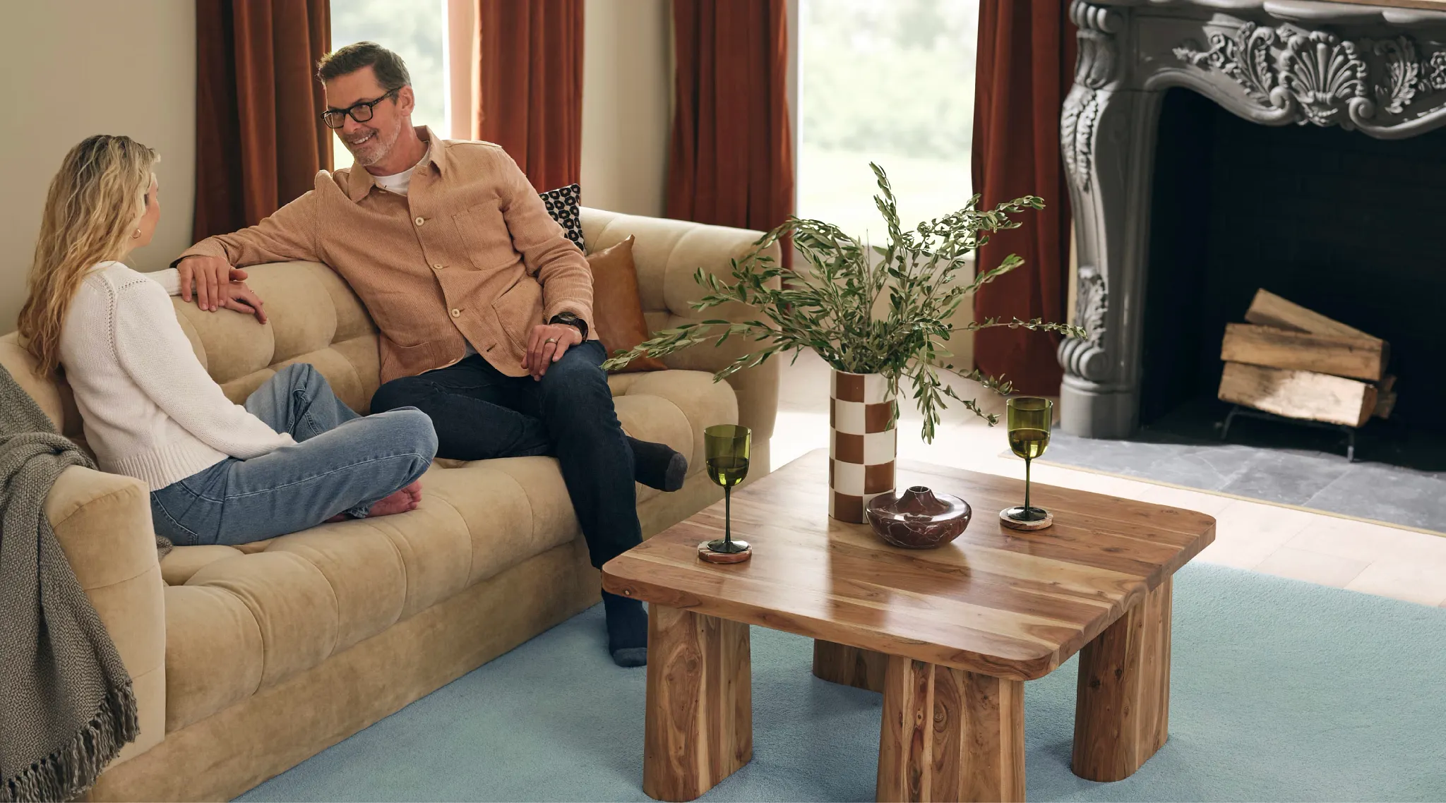 Cozy living room with soft surface flooring and wooden furniture