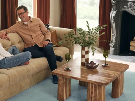 Comfortable and stylish flooring for inviting interiors Cozy living room with soft surface flooring and wooden furniture