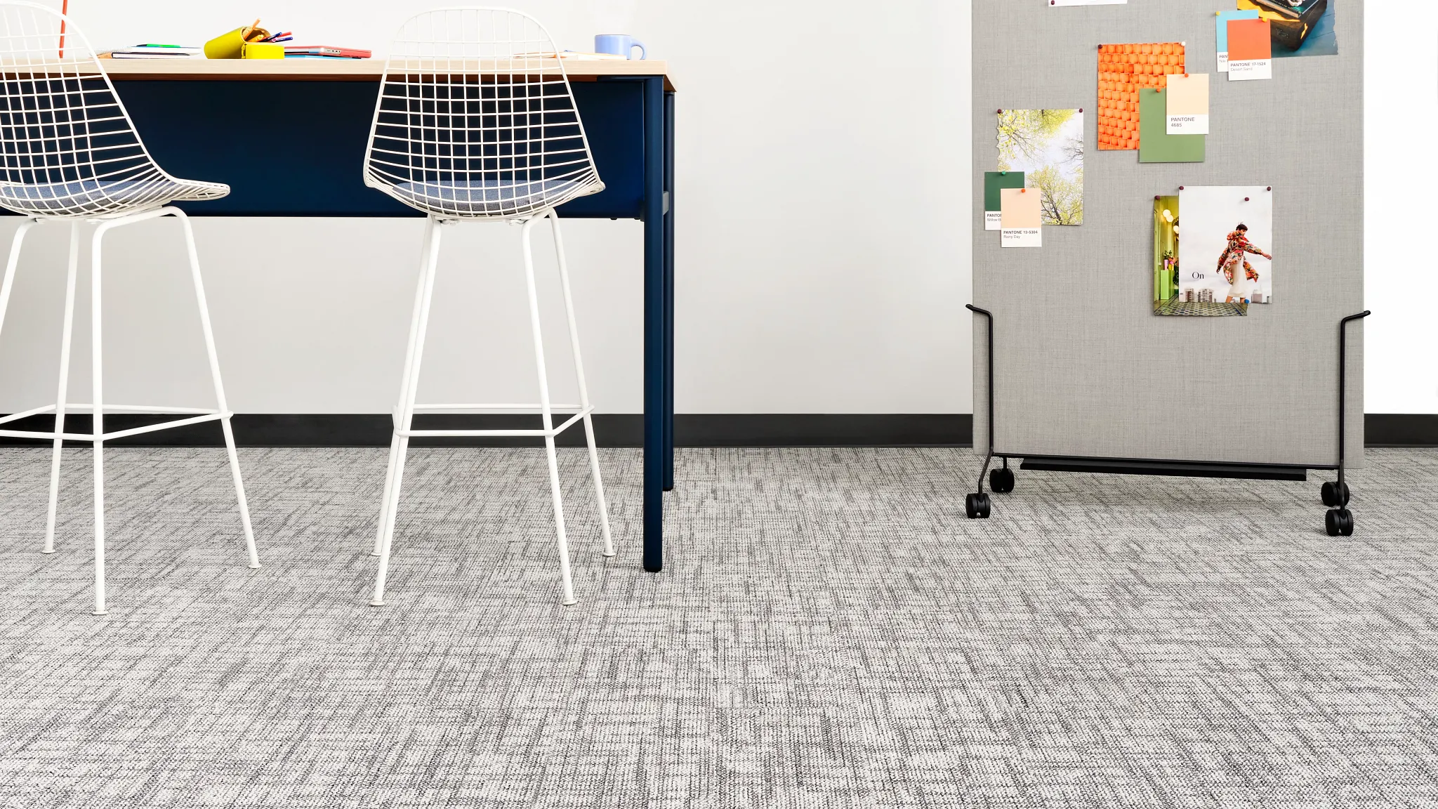 Modern education facility with grey and gold carpet tile flooring