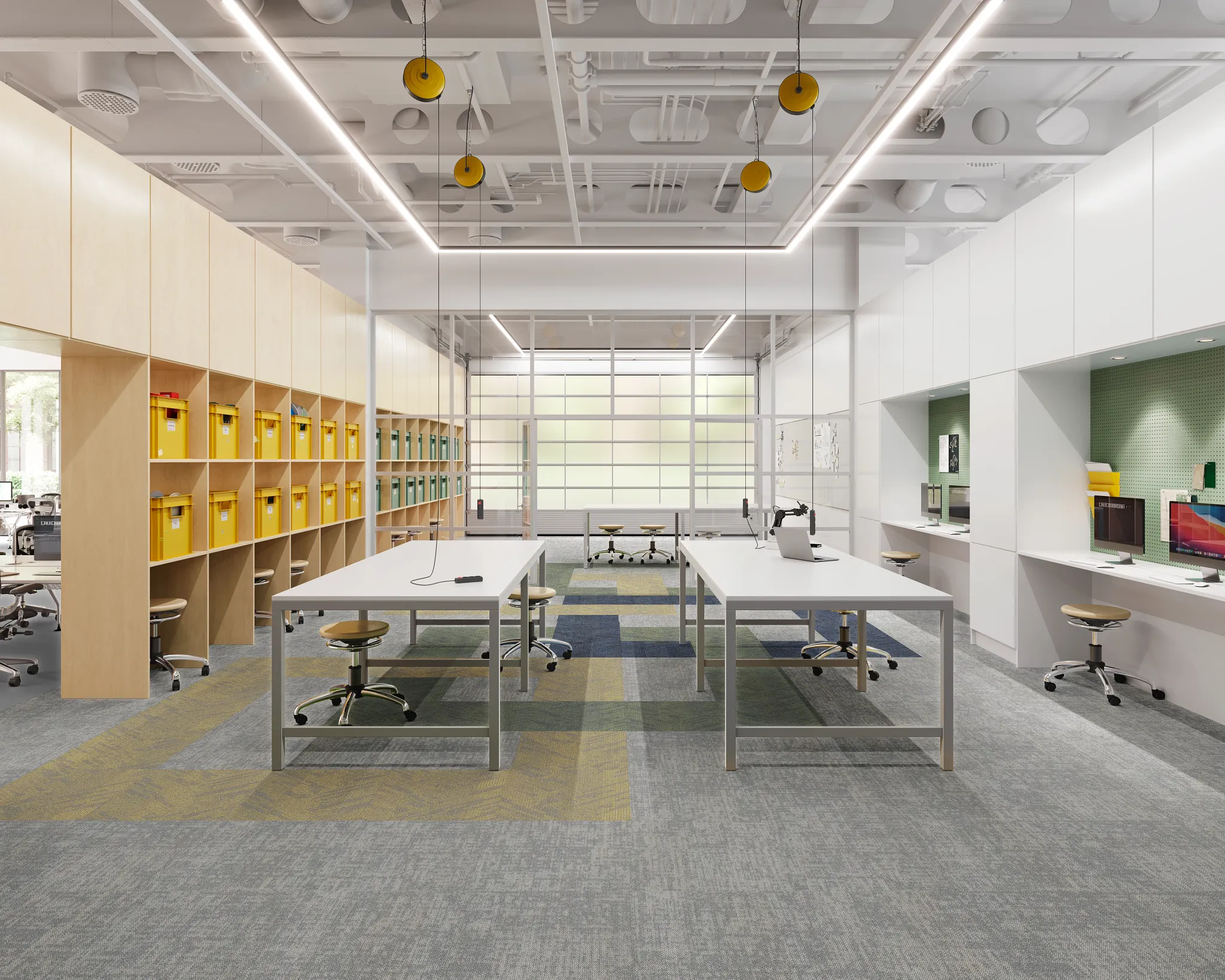 Modern education facility with commercial carpet tile flooring in shades of gray and yellow, featuring spacious workstations and storage units