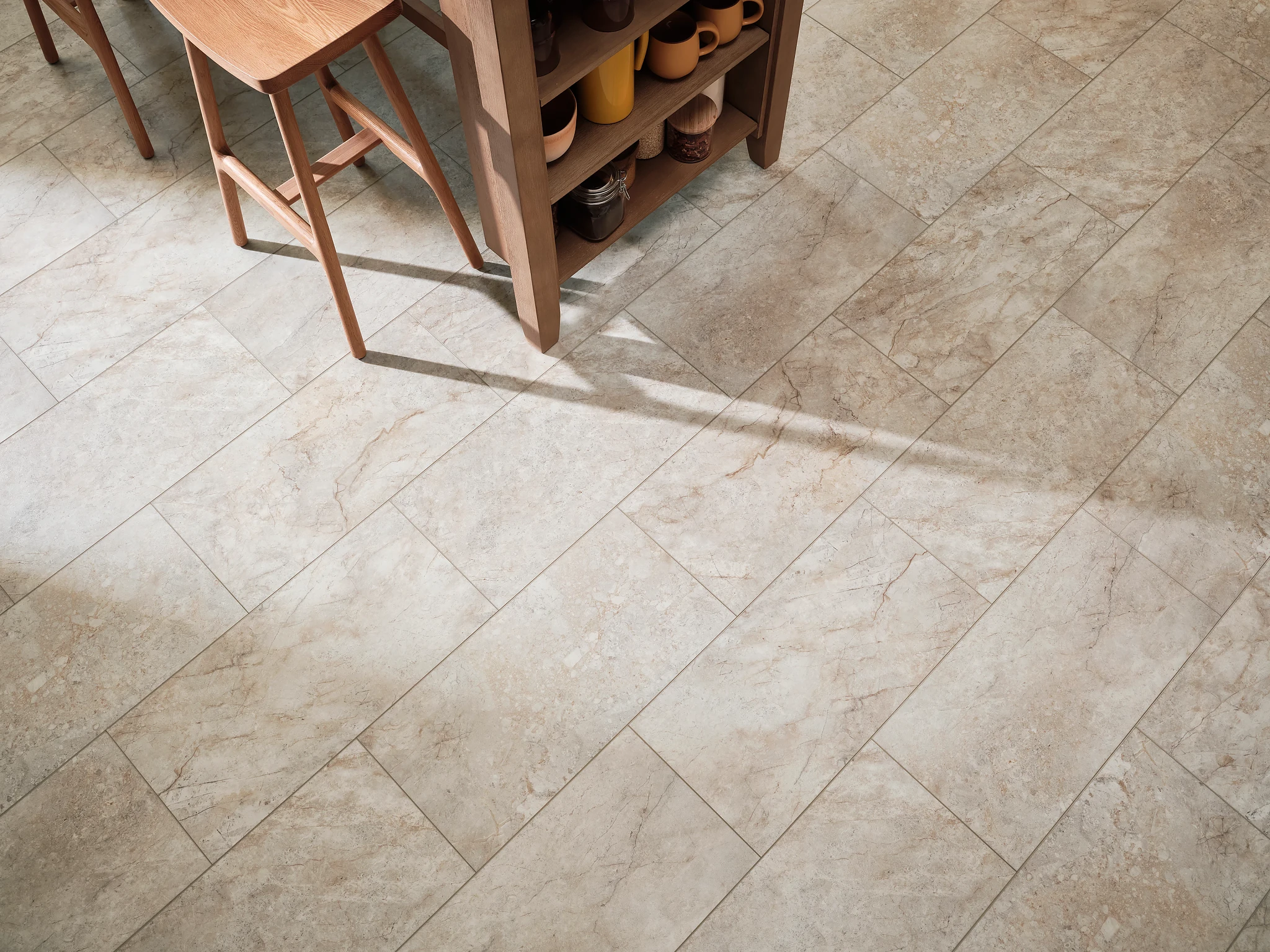 Modern kitchen with beige stone look luxury vinyl tile flooring and wooden furniture
