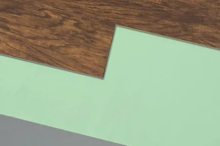 Durable and easy-to-maintain luxury vinyl plank flooring for everyday comfort Luxury vinyl plank flooring in rich brown wood grain with green and gray underlayment