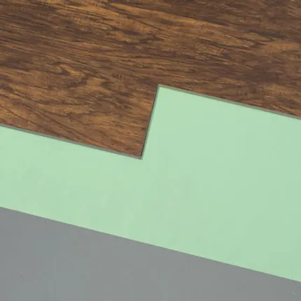Durable and easy-to-maintain luxury vinyl plank flooring for everyday comfort Luxury vinyl plank flooring in rich brown wood grain with green and gray underlayment