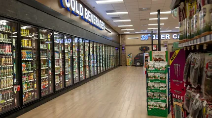 Durable Rigid Mineral Core flooring with 47.55x5.66 inch dimensions Rigid Core flooring in a grocery store aisle