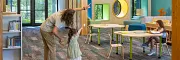 Education Facility with Commercial Carpet Tile Flooring and Wooden Beams Education facility with commercial carpet tile flooring in shades of blue and gray, featuring wooden beams and modern lighting