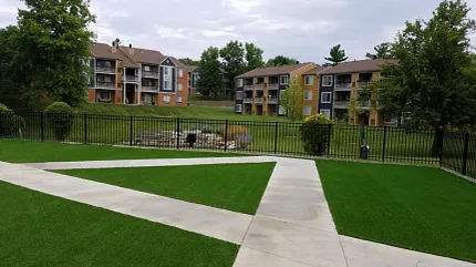 Scenic apartment landscape with lush greenery Outdoor view of apartment complex with green lawns and pathways