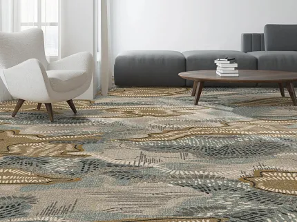 Abstract Patterned Commercial Carpet Tile in Modern Living Room Decor Modern living room with abstract patterned commercial carpet tile in shades of beige, blue, and brown, featuring a white armchair and a gray sectional