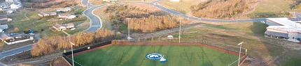 Baseball field with artificial turf in rural setting Aerial view of a baseball field with artificial turf surrounded by rural landscape