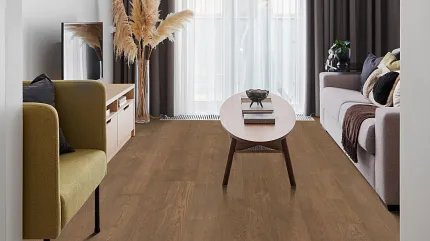 Contemporary living room with stylish brown wood-look flooring and modern furniture. Modern living room with brown wood-look flooring, featuring a beige armchair, a light wood coffee table, and a gray sofa with decorative pillows
