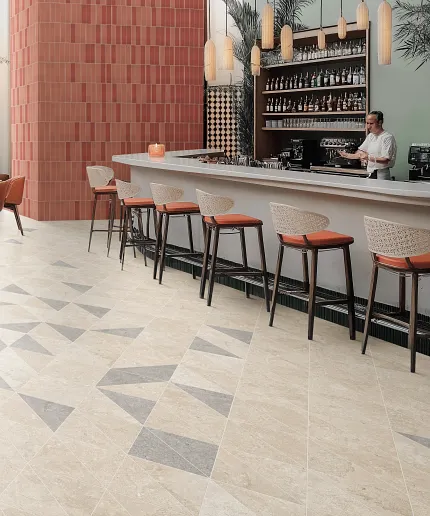 Stylish ceramic tile flooring for hospitality spaces Modern bar area with geometric ceramic tile flooring