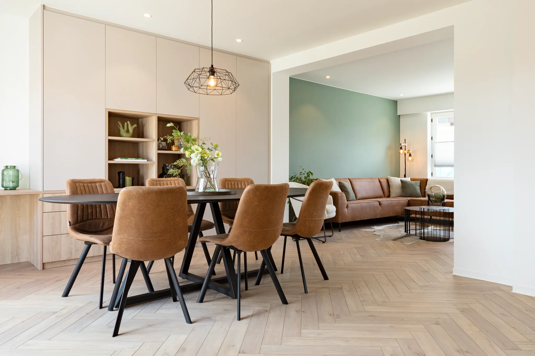Modern dining room with brown chairs and wood look luxury vinyl flooring