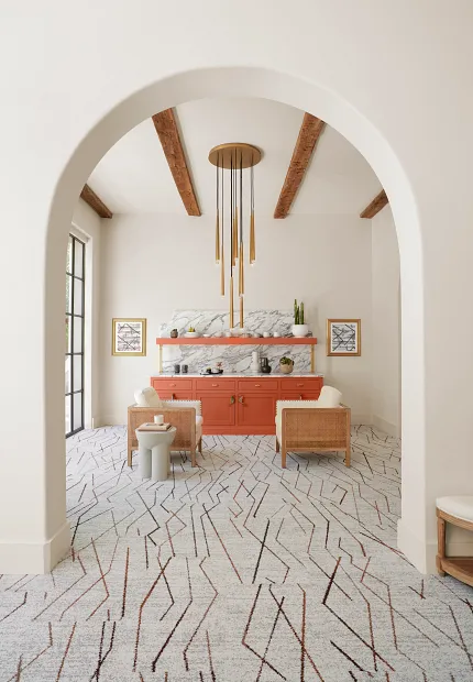 Contemporary living room with geometric carpet and stylish decor