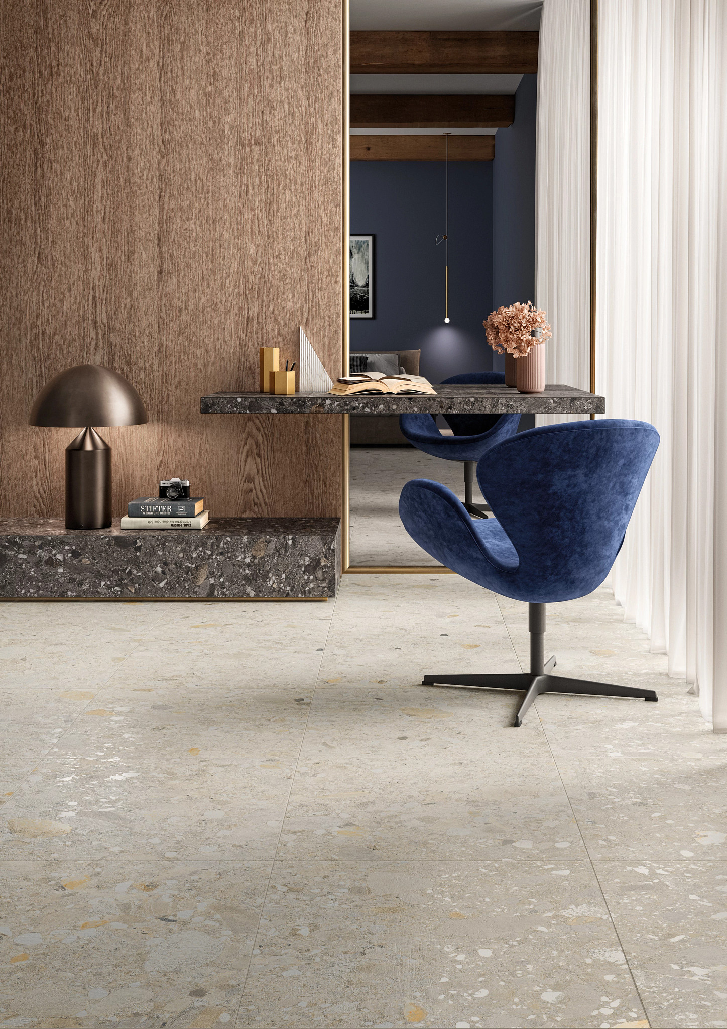 Modern home office with terrazzo tile flooring, wooden wall panel, and blue velvet chair
