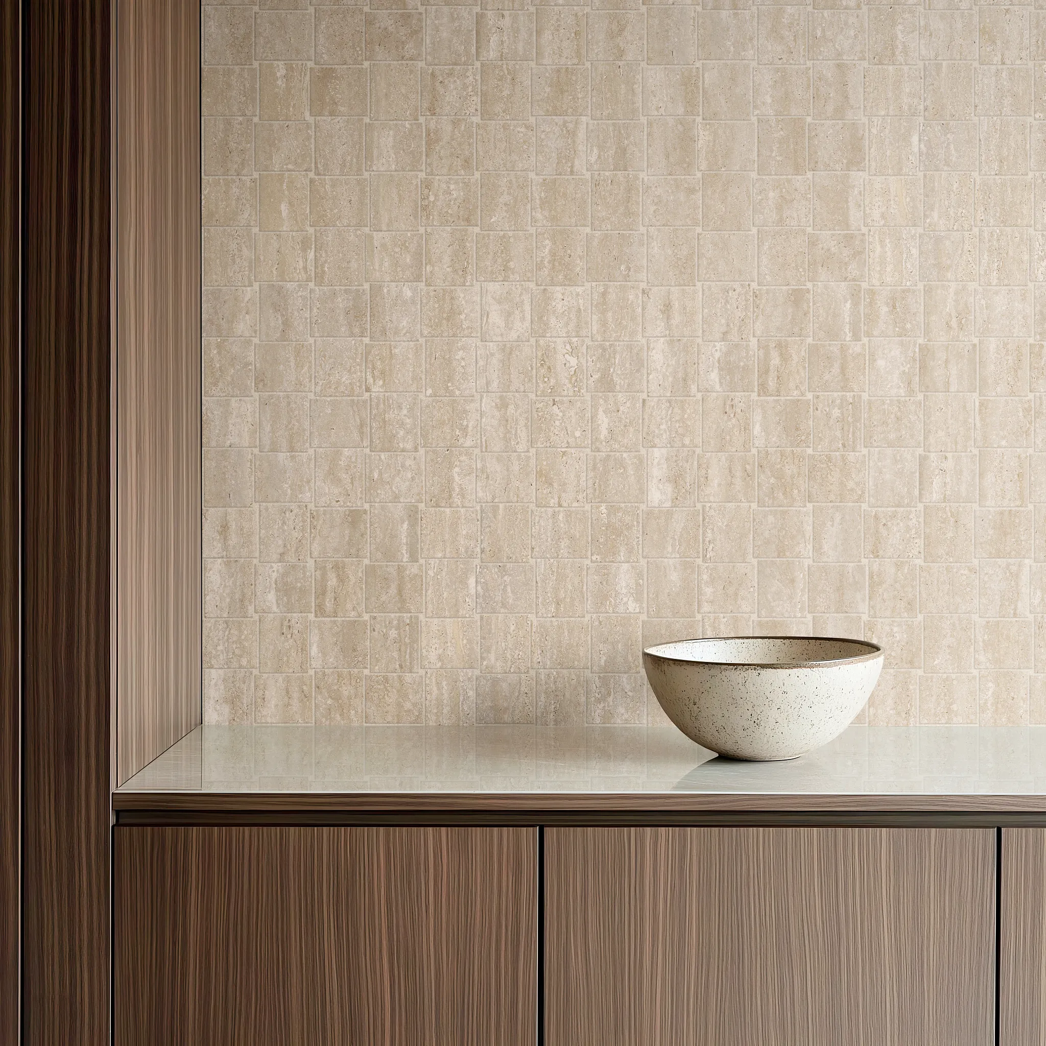 Beige porcelain tile backsplash with wooden cabinetry and ceramic bowl