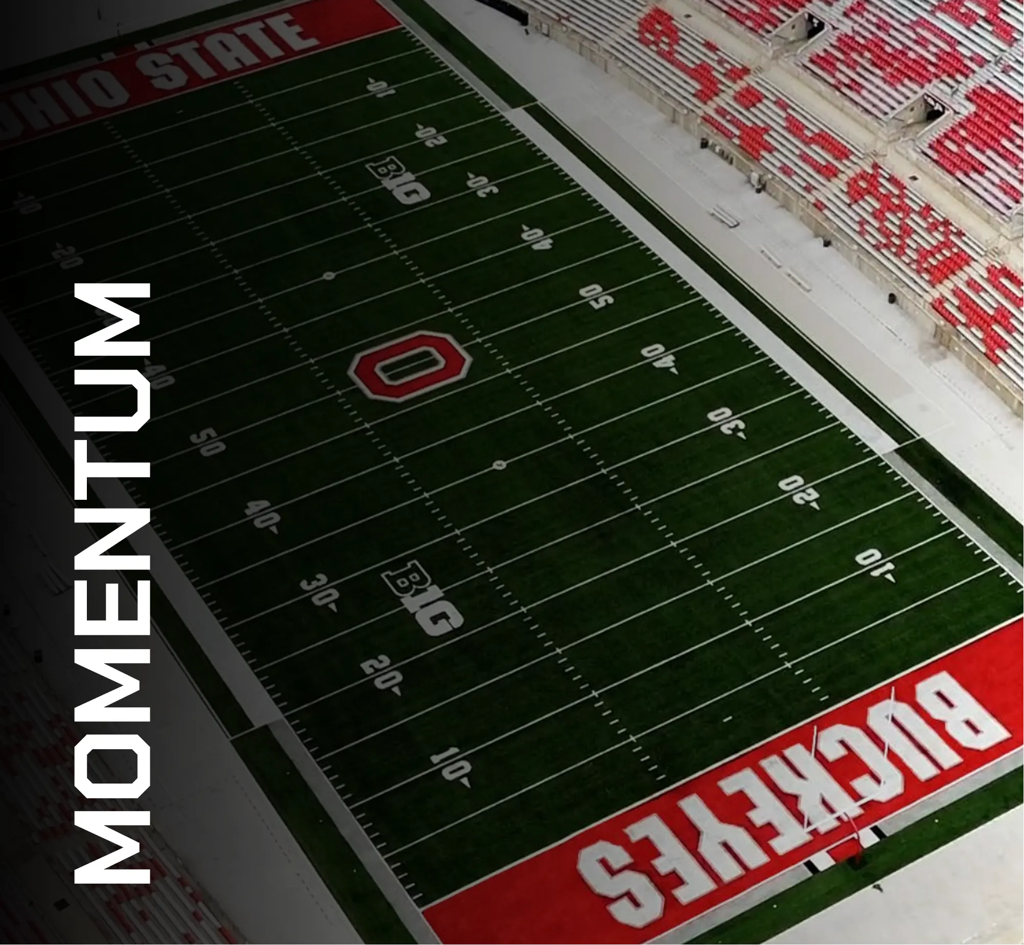 Aerial view of a football field with artificial turf featuring Ohio State branding and Momentum text