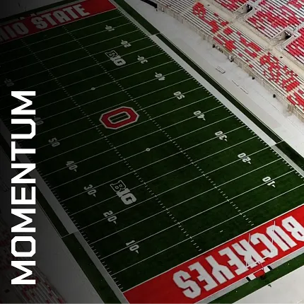 Ohio State Football Field with Artificial Turf and Momentum Branding Aerial view of a football field with artificial turf featuring Ohio State branding and Momentum text