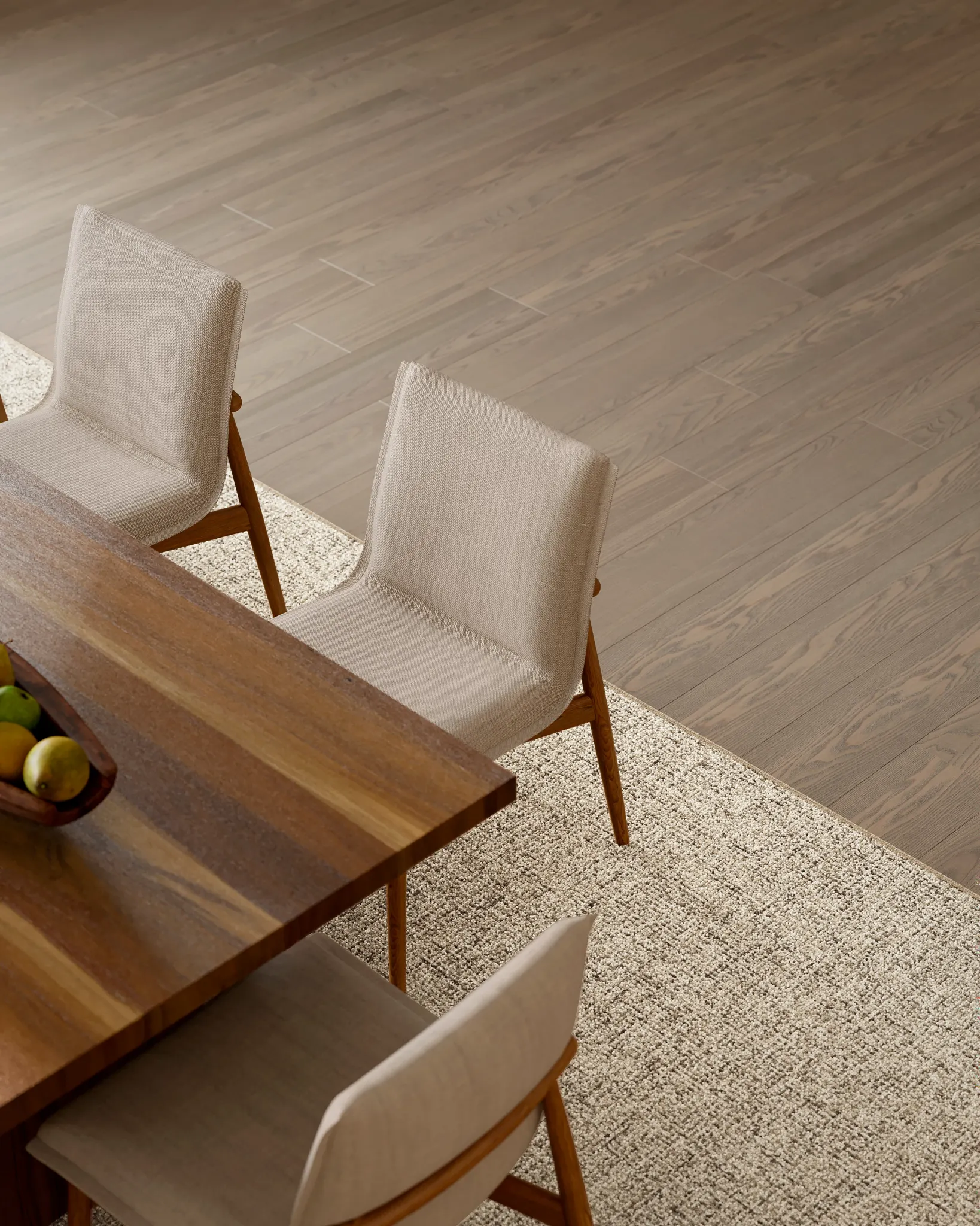 Modern dining room with wooden table and chairs on 100% wool carpet