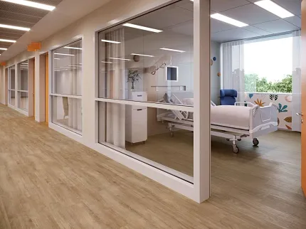 Healthcare Facility with Light Wood-Look Flooring Healthcare facility hallway with light wood-look flooring and patient room