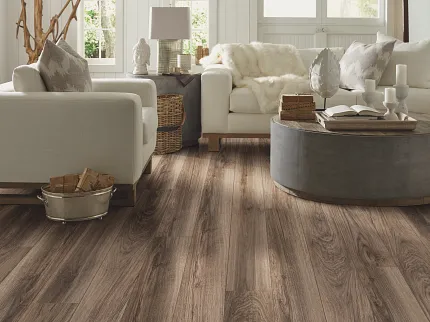 Elegant Hardwood Flooring in a Cozy Living Room Setting Cozy living room with elegant hardwood flooring, featuring a warm brown tone, complemented by modern white and gray furniture