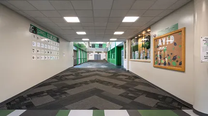 Durable LVT flooring for educational spaces Heavy commercial luxury vinyl tile in an education facility hallway
