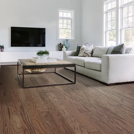 Elegant Hardwood Flooring in a Cozy Living Room Setting Cozy living room with elegant hardwood flooring, featuring a modern coffee table and comfortable sofas