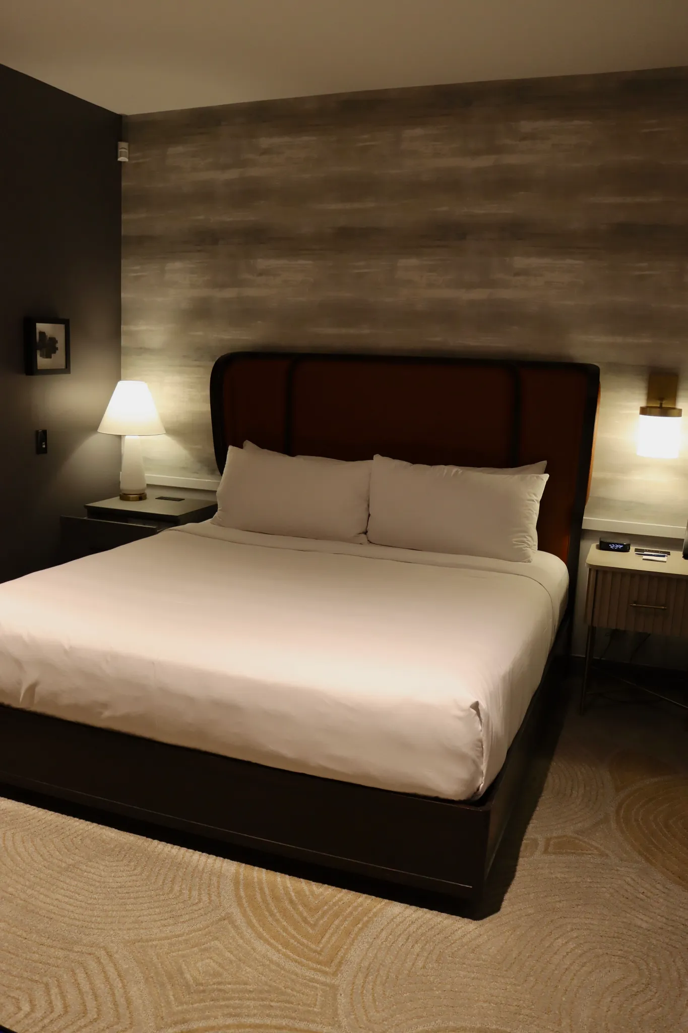Modern hotel room with patterned carpet flooring