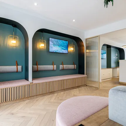 Modern waiting area with herringbone wood flooring
