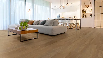 Wood Look Luxury Vinyl Plank Flooring in Modern Living Room Scene living room with wood look luxury vinyl plank floor with a layout with a large sectional sofa and  decor