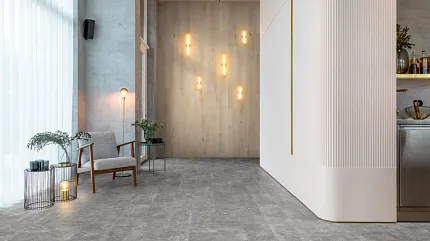 Gray Stone Look Luxury Vinyl Tile Flooring in Modern Living Room Scene Modern living room with gray stone look luxury vinyl tile flooring, featuring contemporary decor and ambient lighting.