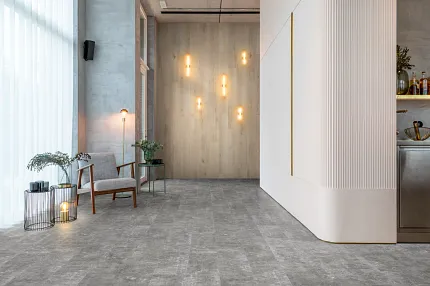 Gray Stone Look Luxury Vinyl Tile Flooring in Modern Living Room Scene Modern living room with gray stone look luxury vinyl tile flooring, featuring contemporary decor and ambient lighting.
