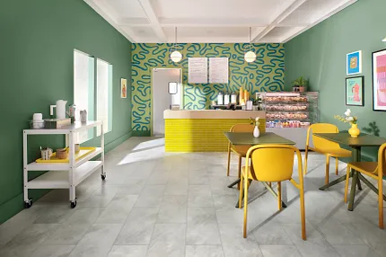 Cheerful colored cafe or bistro scene Brightly colored green and yellow cafe featuring COREtec tile look vinyl flooring.