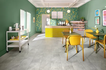 Cheerful colored cafe or bistro scene Brightly colored green and yellow cafe featuring COREtec tile look vinyl flooring.
