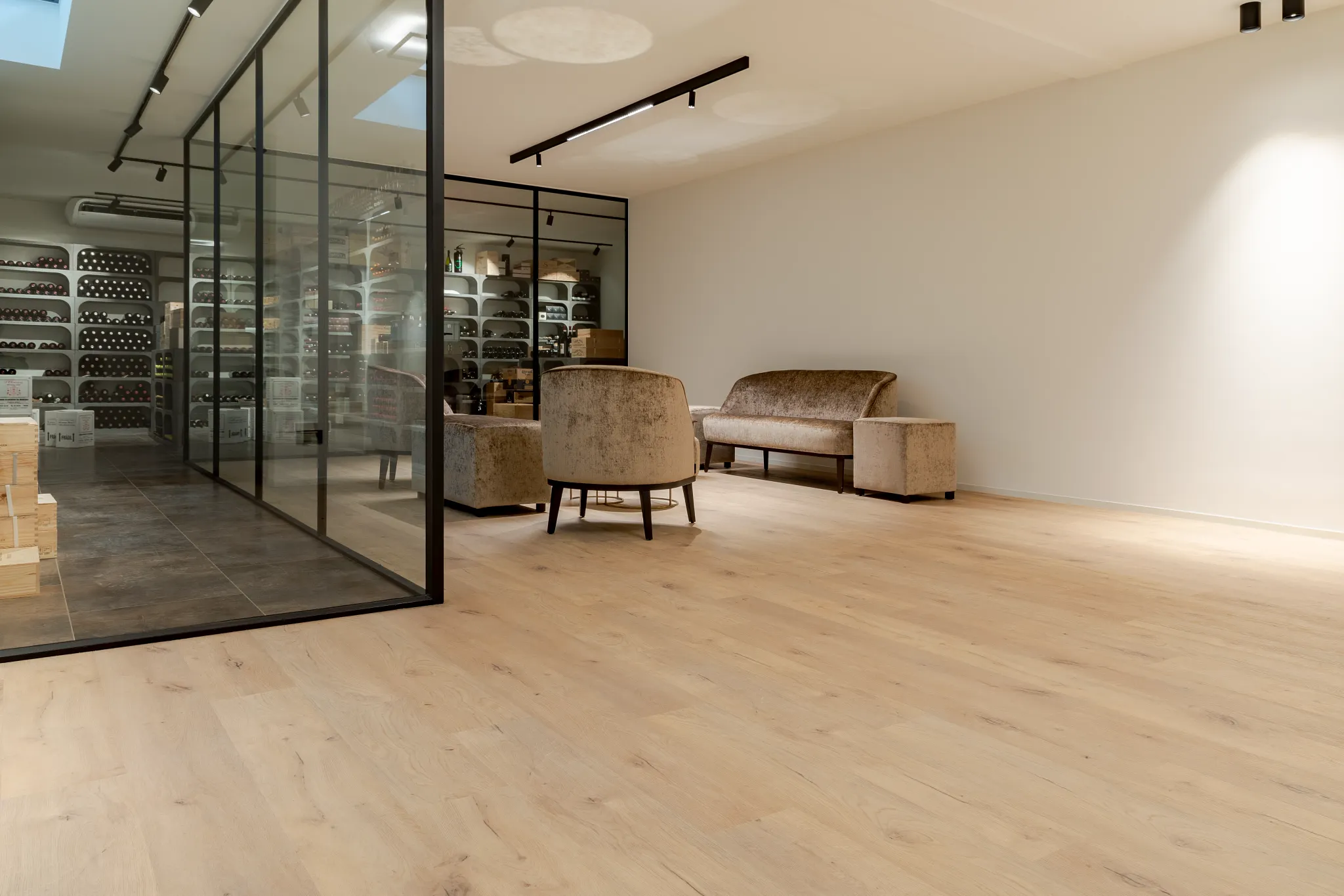 Light oak flooring in a modern wine cellar lounge