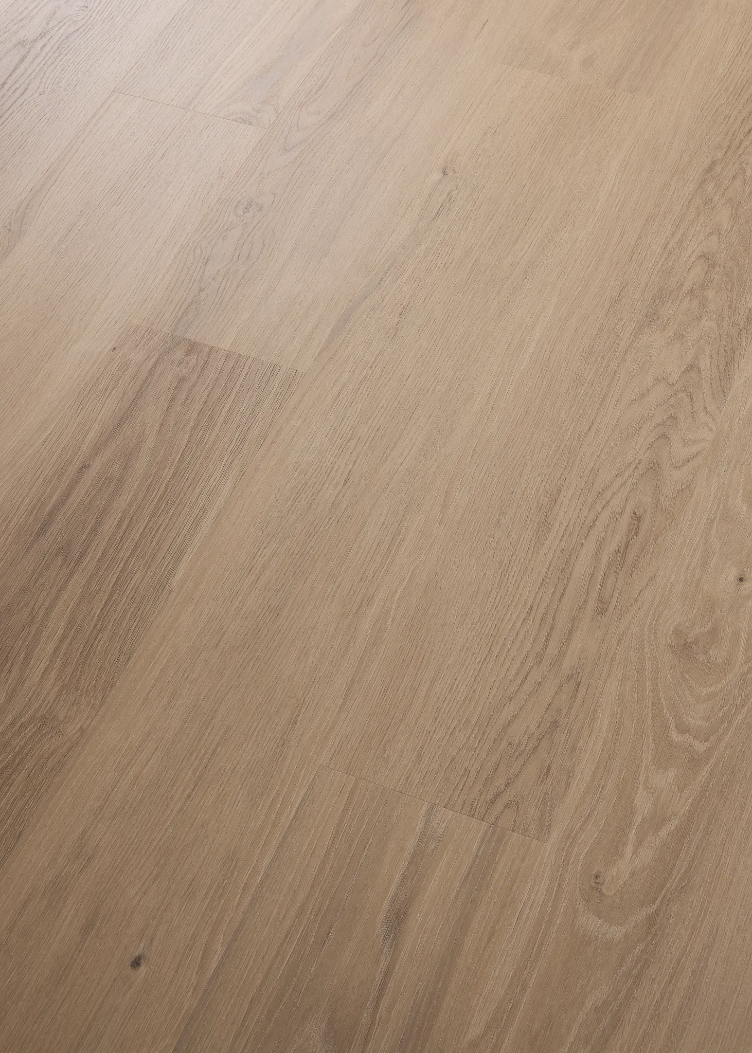 Light brown wood look luxury vinyl plank flooring with natural grain patterns