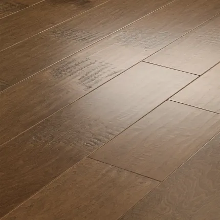 Brown Hardwood Flooring with Smooth Finish and Subtle Grain Patterns Close-up view of brown hardwood flooring with a smooth finish and subtle grain patterns