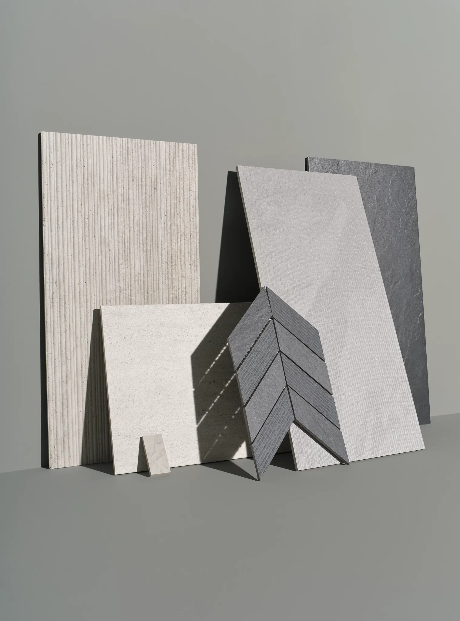 Assorted porcelain tile samples in neutral tones
