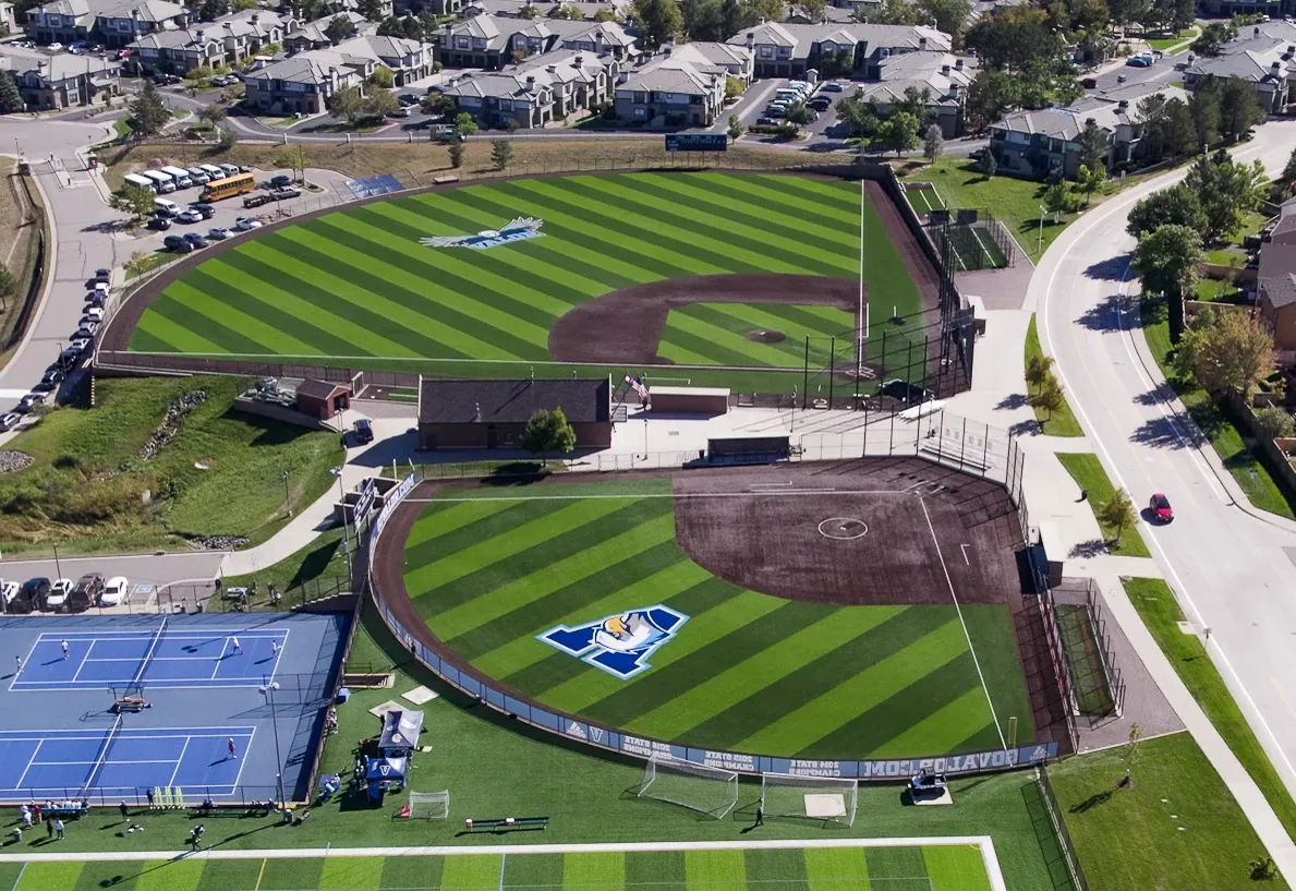 Aerial view of sports complex with baseball fields and tennis courts