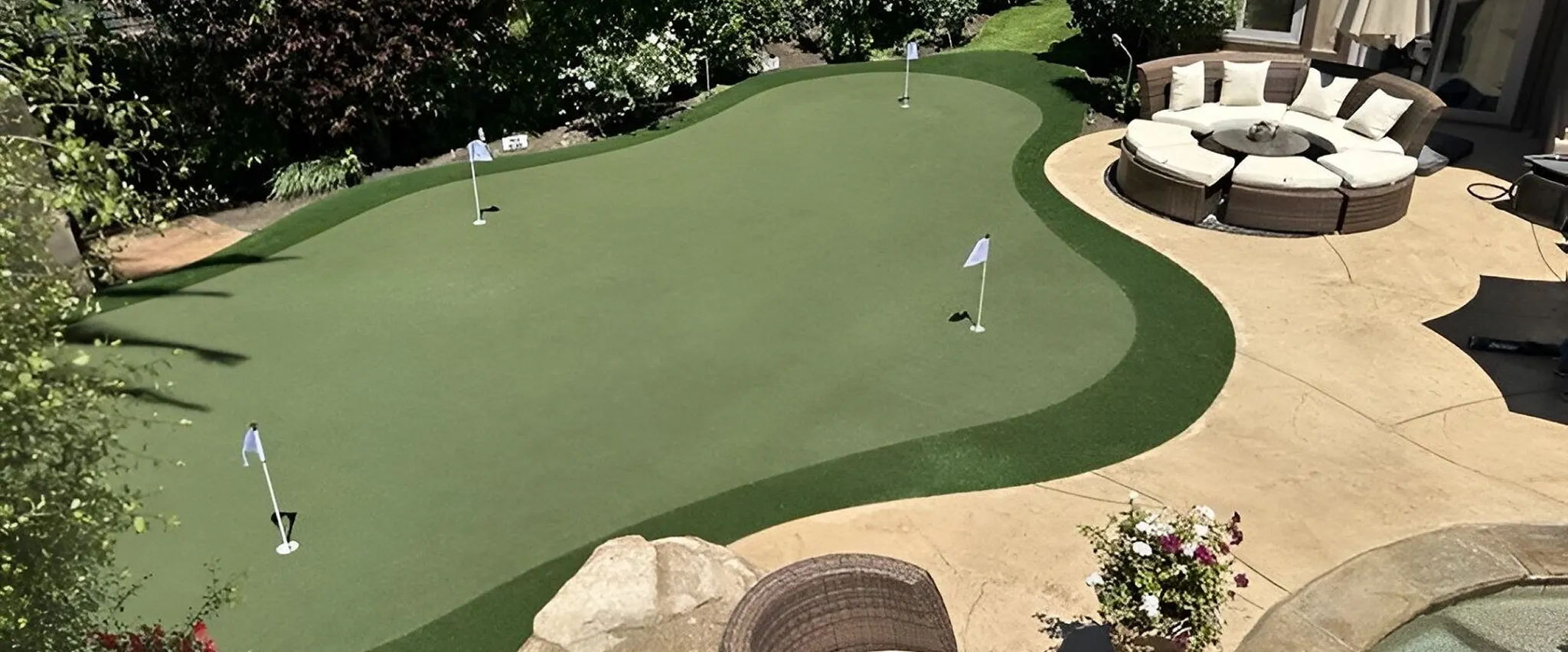 Outdoor putting green with seating area