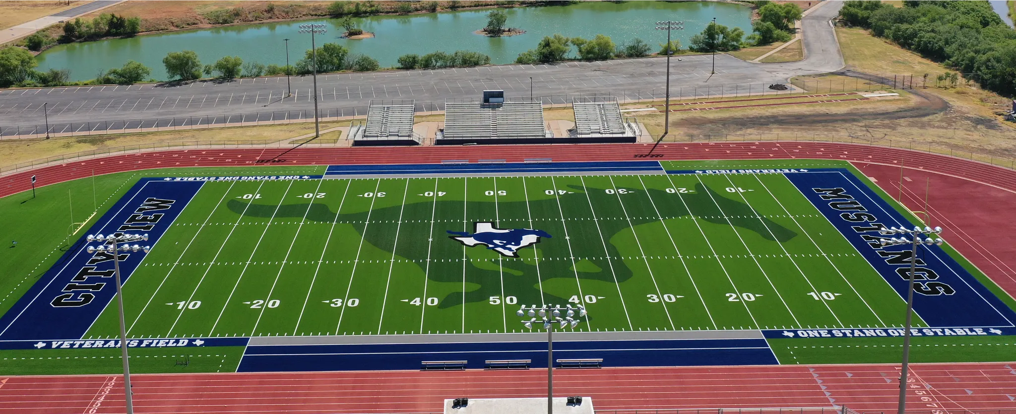 Aerial view of a football field with artificial turf