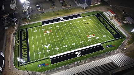 Montana Tech football field with artificial turf under stadium lights. Aerial view of a football field with artificial turf at Montana Tech