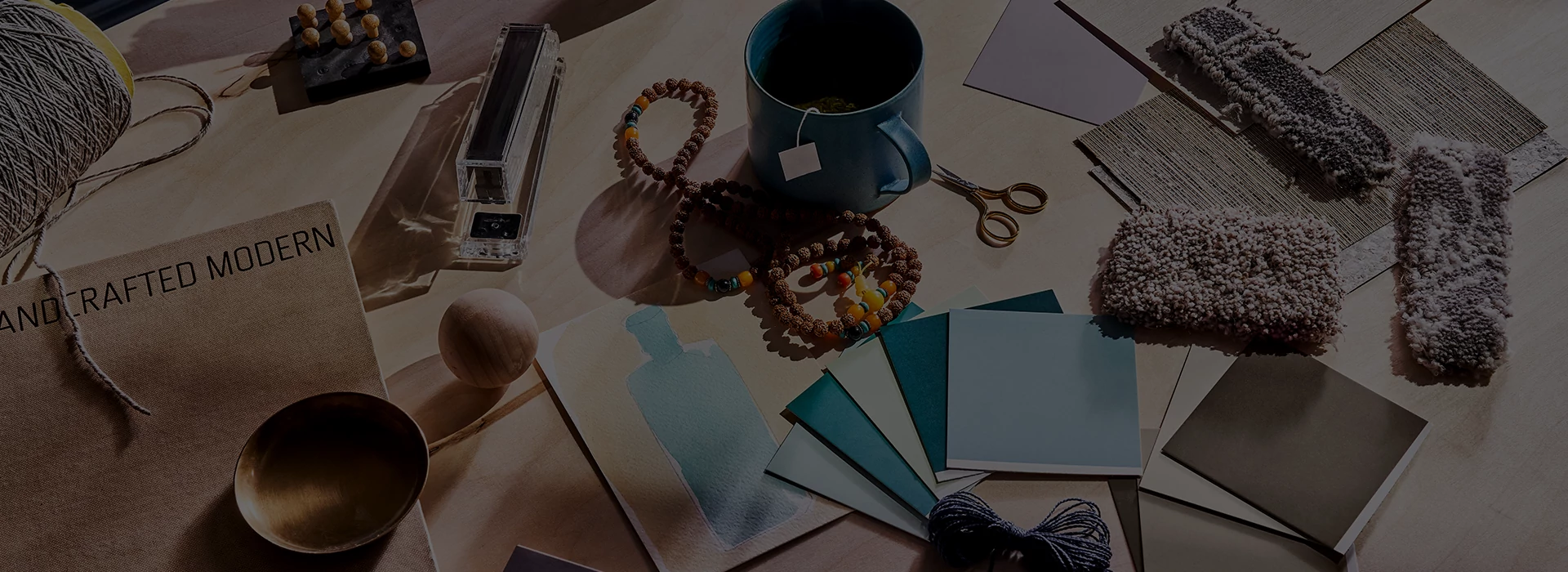 Table full of coloor swatches, product swatches and books