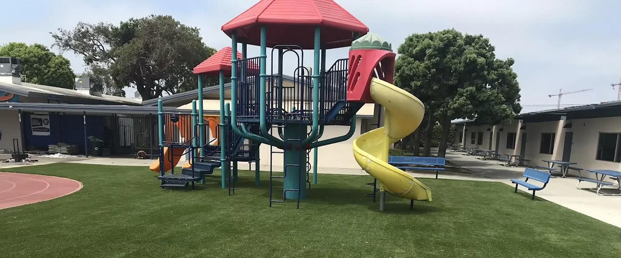Colorful playground equipment on green grass