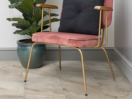 Beige Marble Tile Flooring in Modern Living Room with Pink Velvet Chair and Green Plant living room with beige marble tile floor with a pink velvet chair with a black cushion and a green potted plant