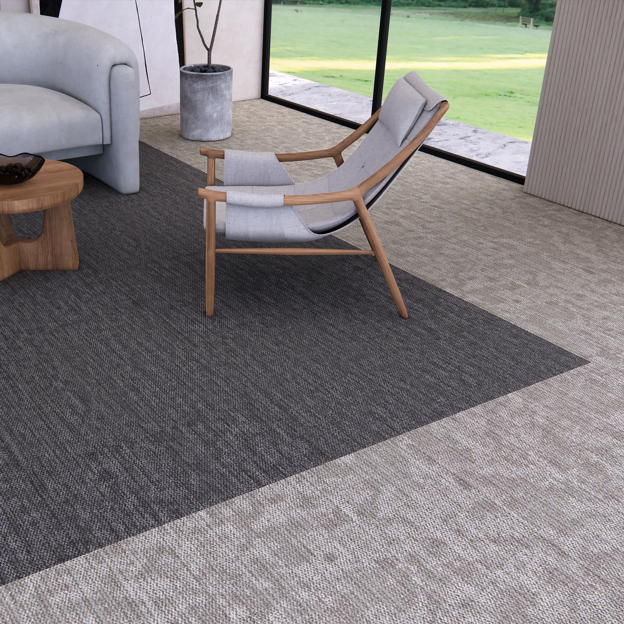Terra Tile carpet tile from the Core Elements collection by Shaw Contract installed in a contemporary commercial lounge featuring a curved sofa, timber lounge chair, round coffee table and floor-to-ceiling windows with views of landscaped greenery.