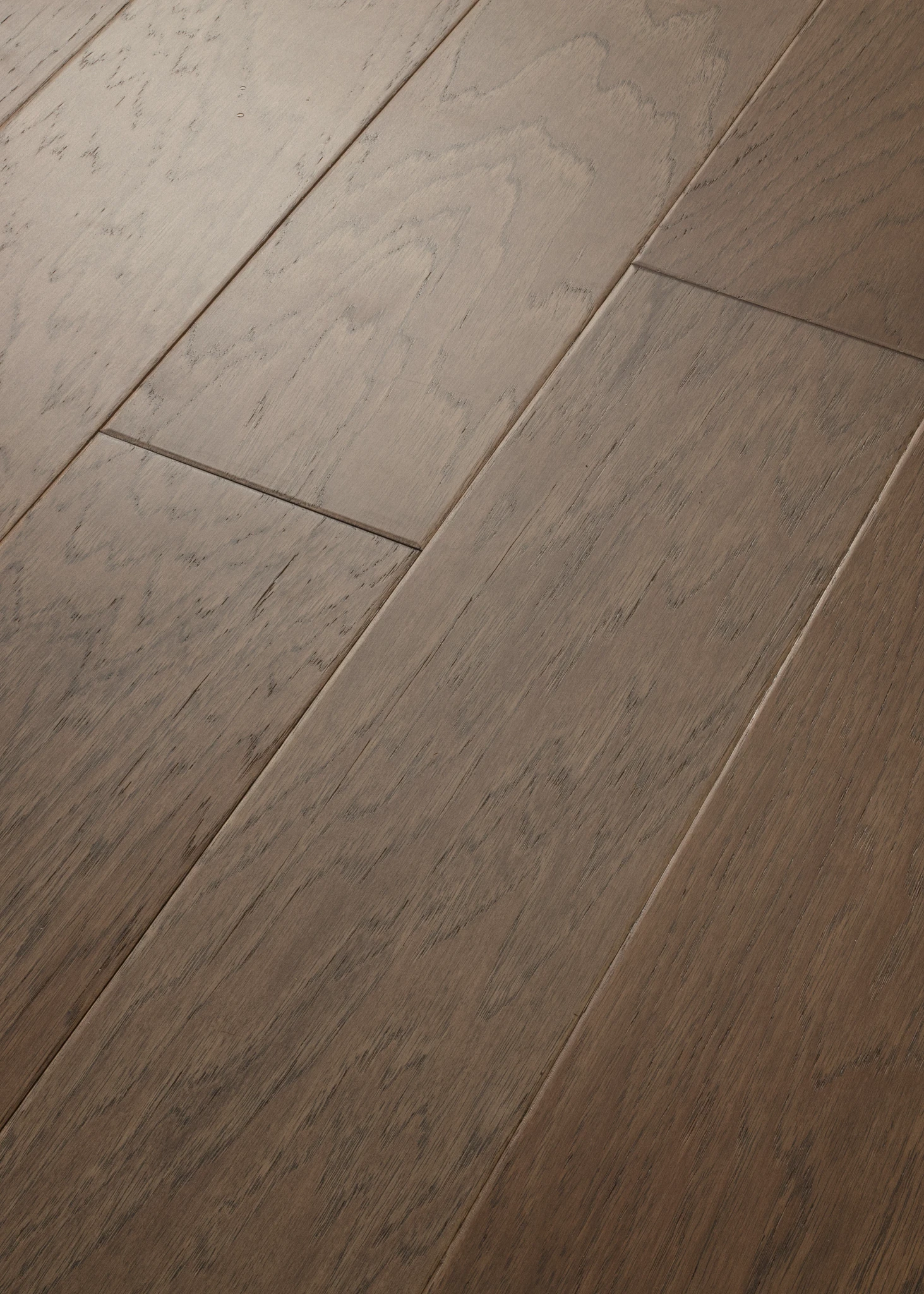 Close-up of hardwood flooring with a smooth, matte finish in shades of brown