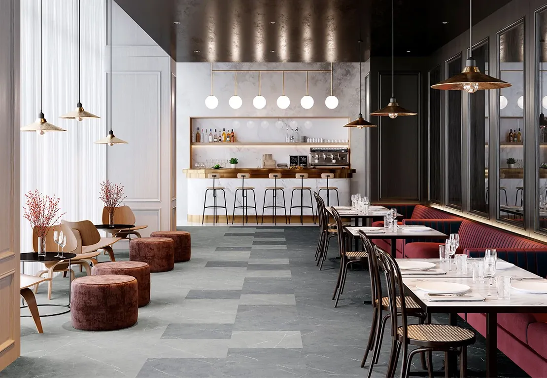 Modern hospitality setting with elegant dining area and bar, featuring dark and light gray commercial porcelain tile flooring