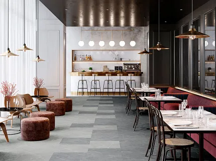 Hospitality dining area with commercial porcelain tile flooring in gray tones Modern hospitality setting with elegant dining area and bar, featuring dark and light gray commercial porcelain tile flooring