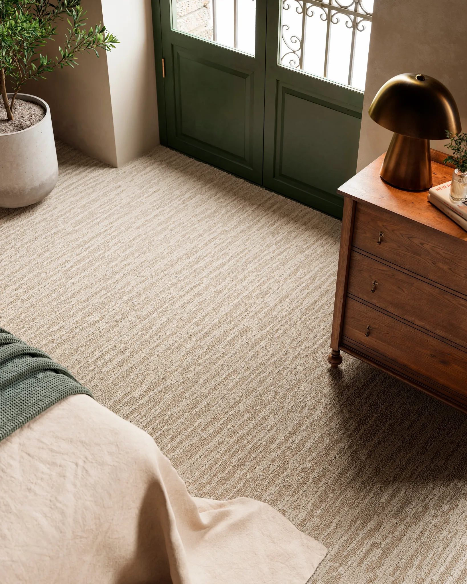 Blue and beige checkered carpet with light hardwood flooring and brown shoes